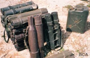 Green plastic ammunition storage tubes