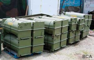 Large green aluminum engine containers