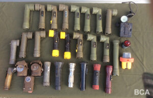 Selection of vintage and military flashlights