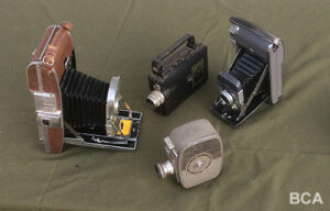 Polaroid and compact movie cameras