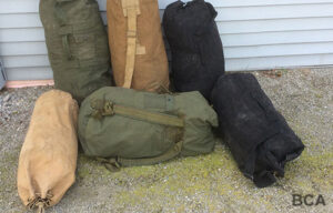 Various army duffle bags