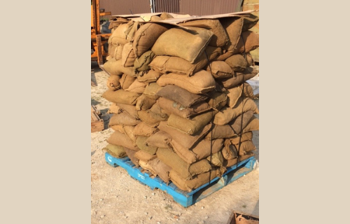 Burlap woodchip-filled sandbags